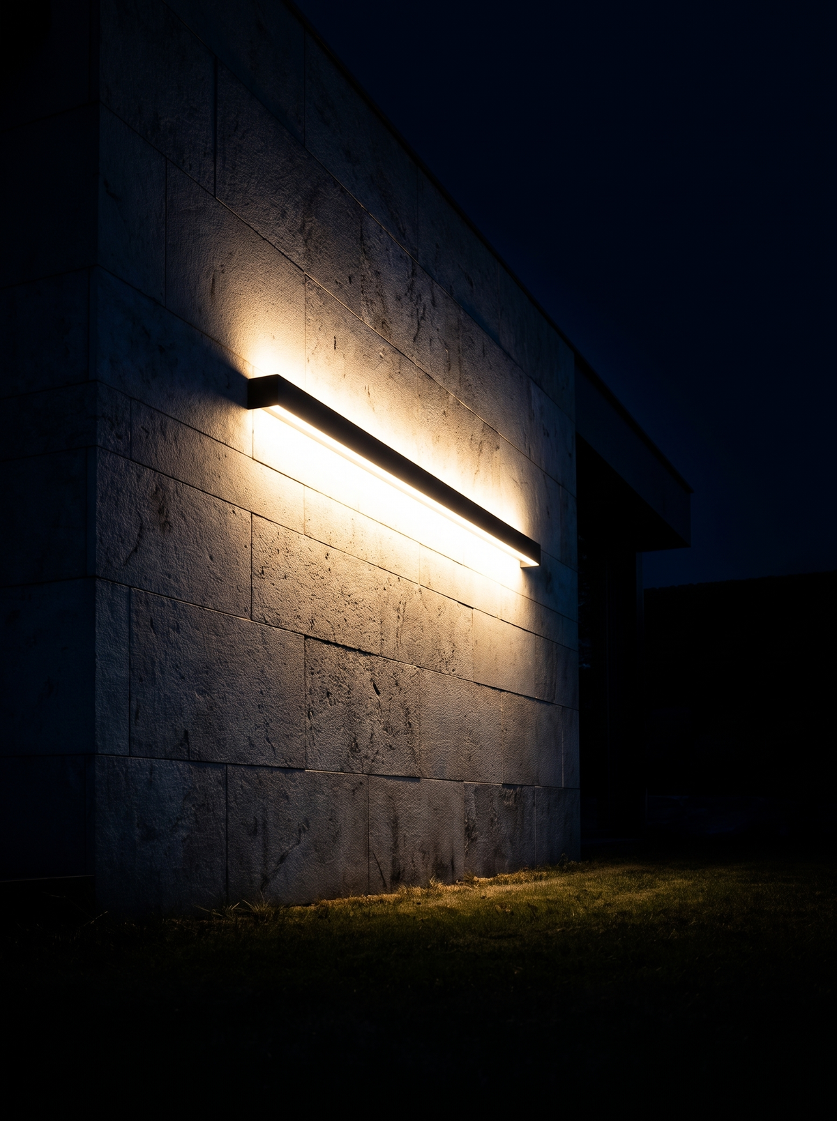 Long Bar Outdoor Wall Light lit at night