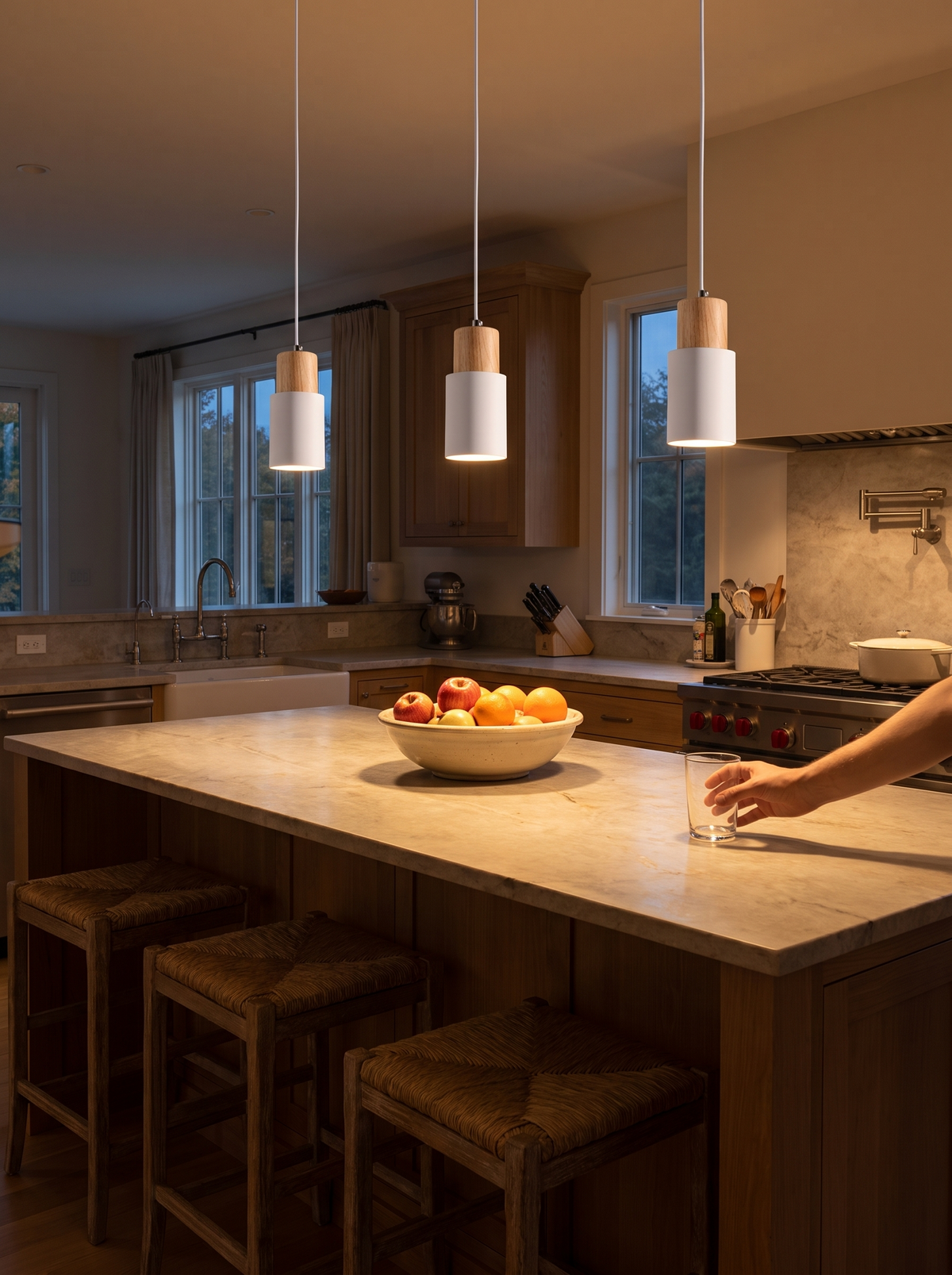 Macaron cylinder pendants over kitchen island