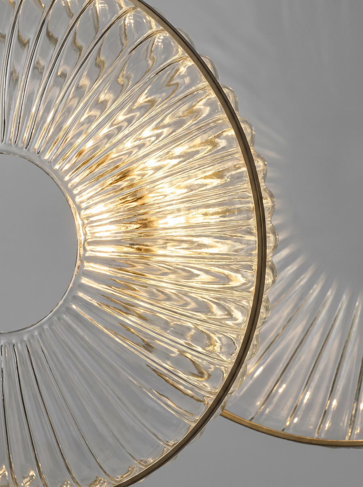Striped glass disc wall sconce close up