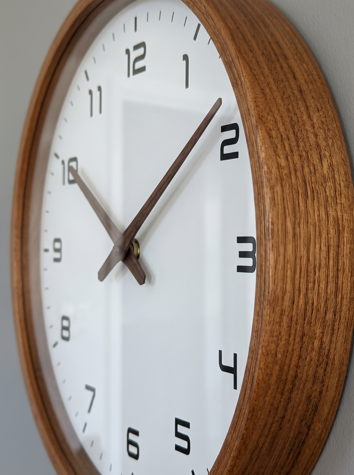 Nordic wood wall clock close up