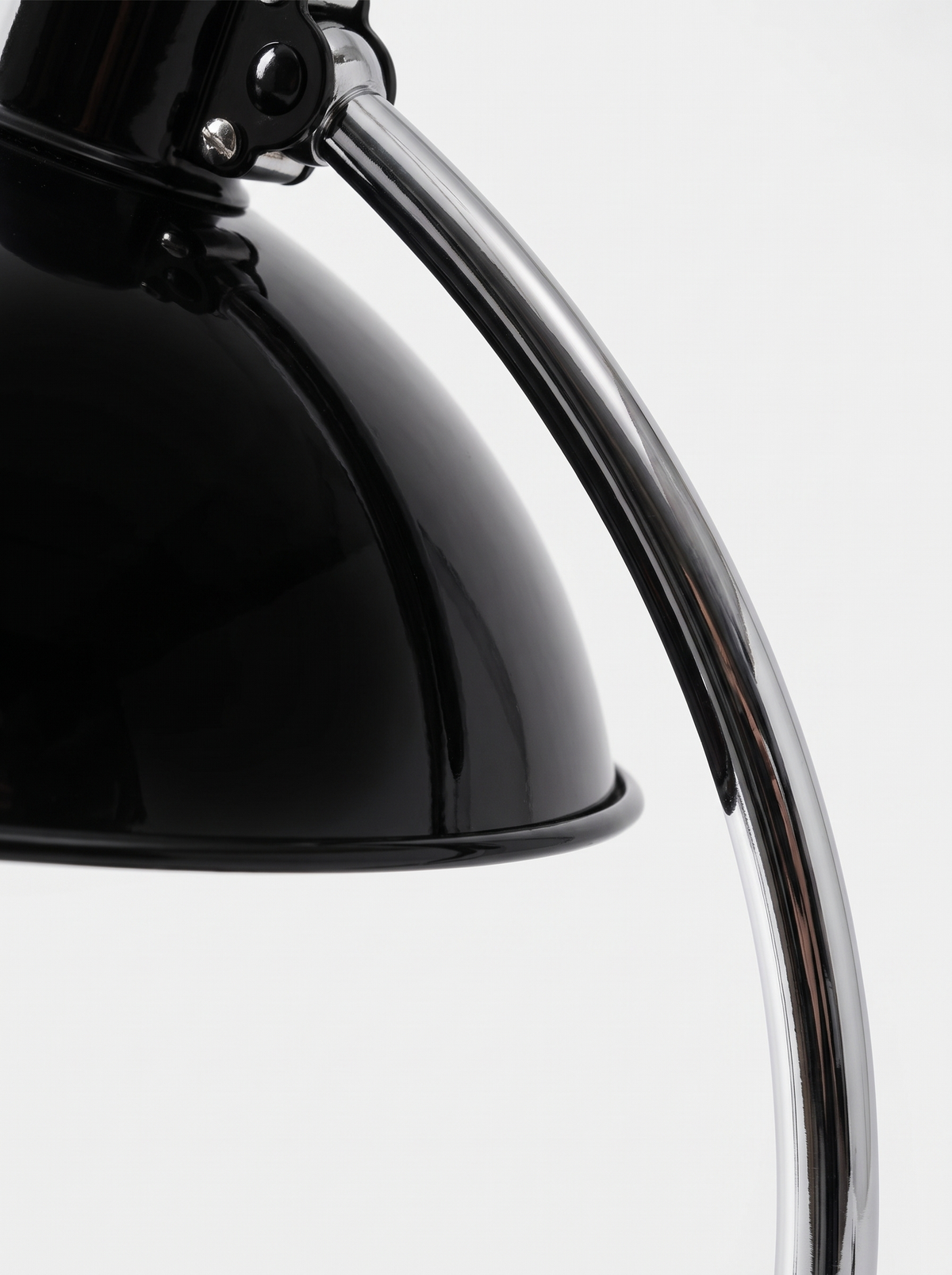Arched chrome table lamp close up