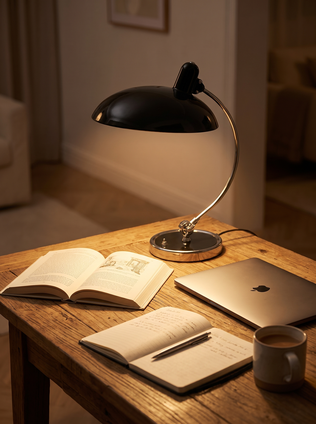 Arched chrome table lamp on a desk