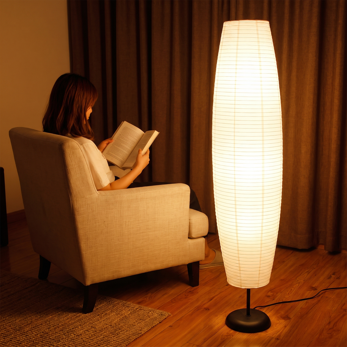Rice paper floor lamp beside a seated reader showing its 54 inch height